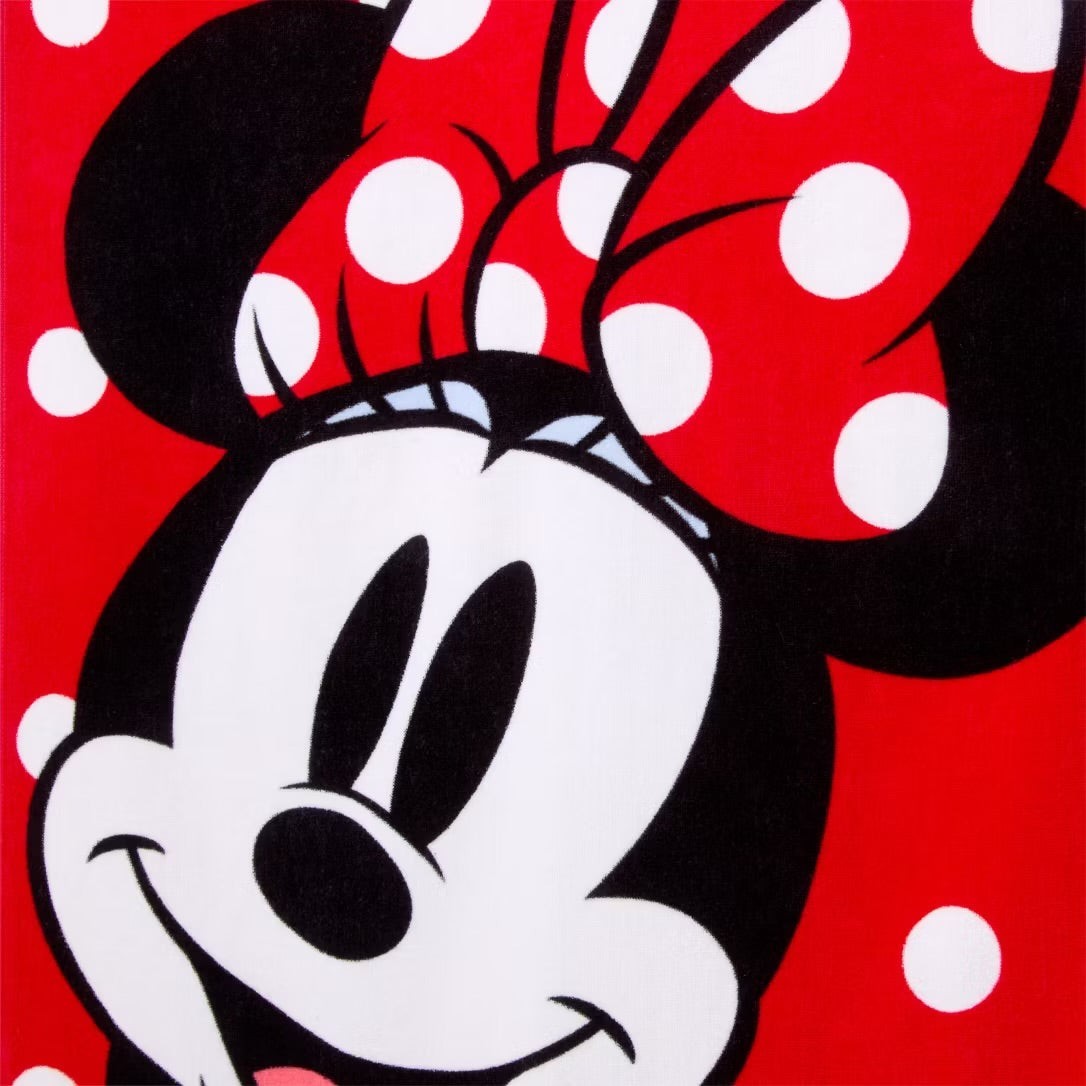 Once Upon Magic red Minnie Mouse bath towel with iconic white polka dot bow design