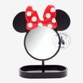 Once Upon Magic black standing mirror with Minnie Mouse ears and red polka dot bow on top. Features a small tray at the base.