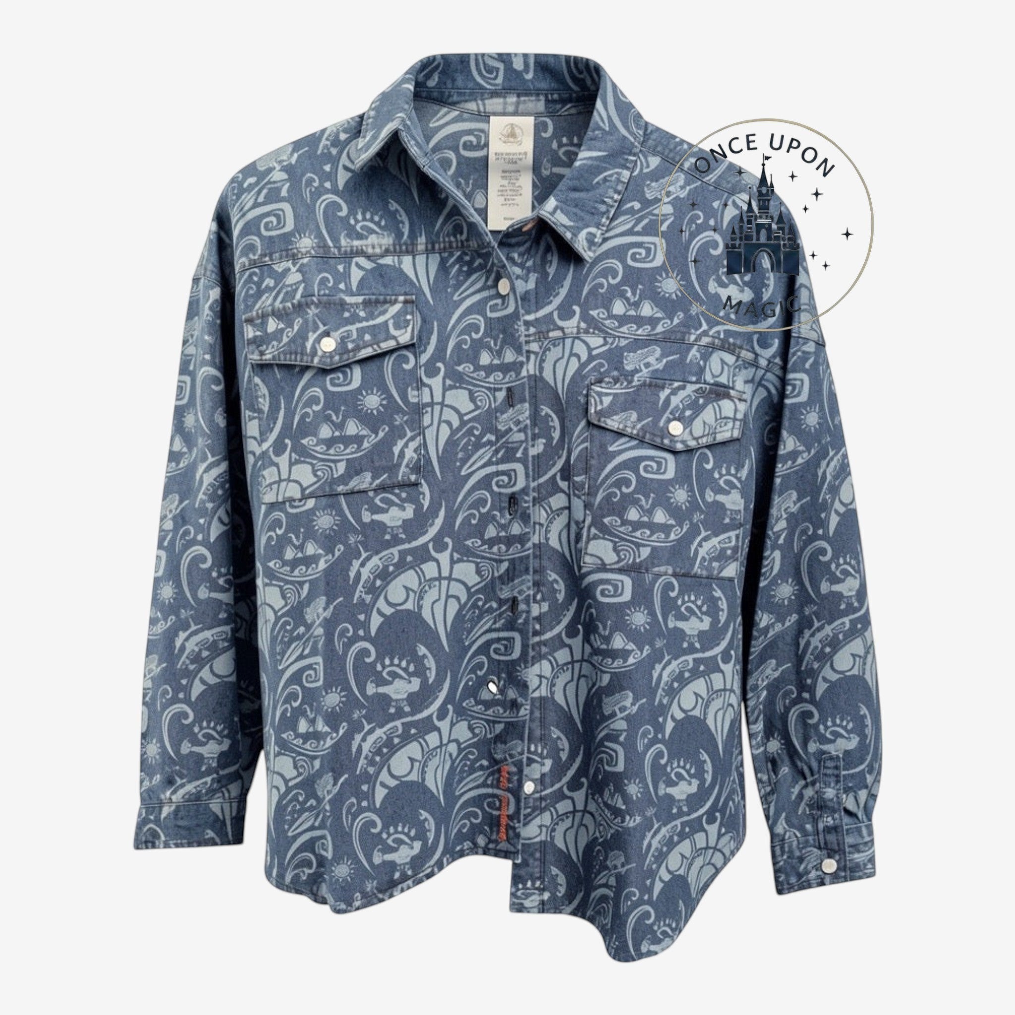 Once Upon Magic blue denim button-down shirt featuring a white Moana-inspired tribal print and dual chest pockets.