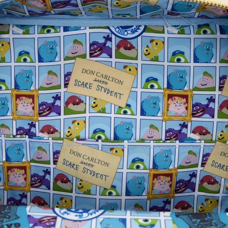 Once Upon Magic Monsters Inc. house crossbody bag lining with Sulley, Mike, and Randall characters. Features "Don Carlton Sales Scare Student" tags.