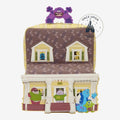 Once Upon Magic Monsters Inc. house backpack with Sulley, Mike, Randall, and other characters. Features 3D design, roof, windows, and porch.