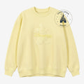 Once Upon Magic pale yellow crewneck sweatshirt featuring a tonal embossed Mickey Mouse and Disneyland Paris logo.
