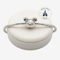 Once Upon Magic silver Pandora Disney Parks charm bracelet with a character clasp on a white display stand.