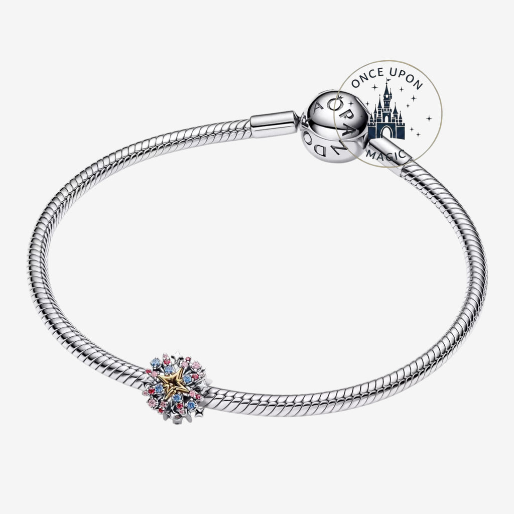 Once Upon Magic Pandora x Disney Firework Couple Charm with pink, blue, and clear stones on a silver bracelet.