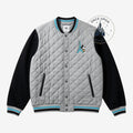 Once Upon Magic grey quilted teddy jacket with black sleeves, featuring Mickey Mouse and the Eiffel Tower graphic. Ribbed cuffs and collar.