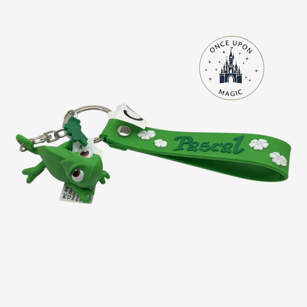 Once Upon Magic green Pascal the chameleon keychain from Disney's Tangled with flower details and "Pascal" text.