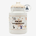 Once Upon Magic ceramic pet treat jar with Disney characters Stitch, Marie, and dogs. Creamy white with paw prints.