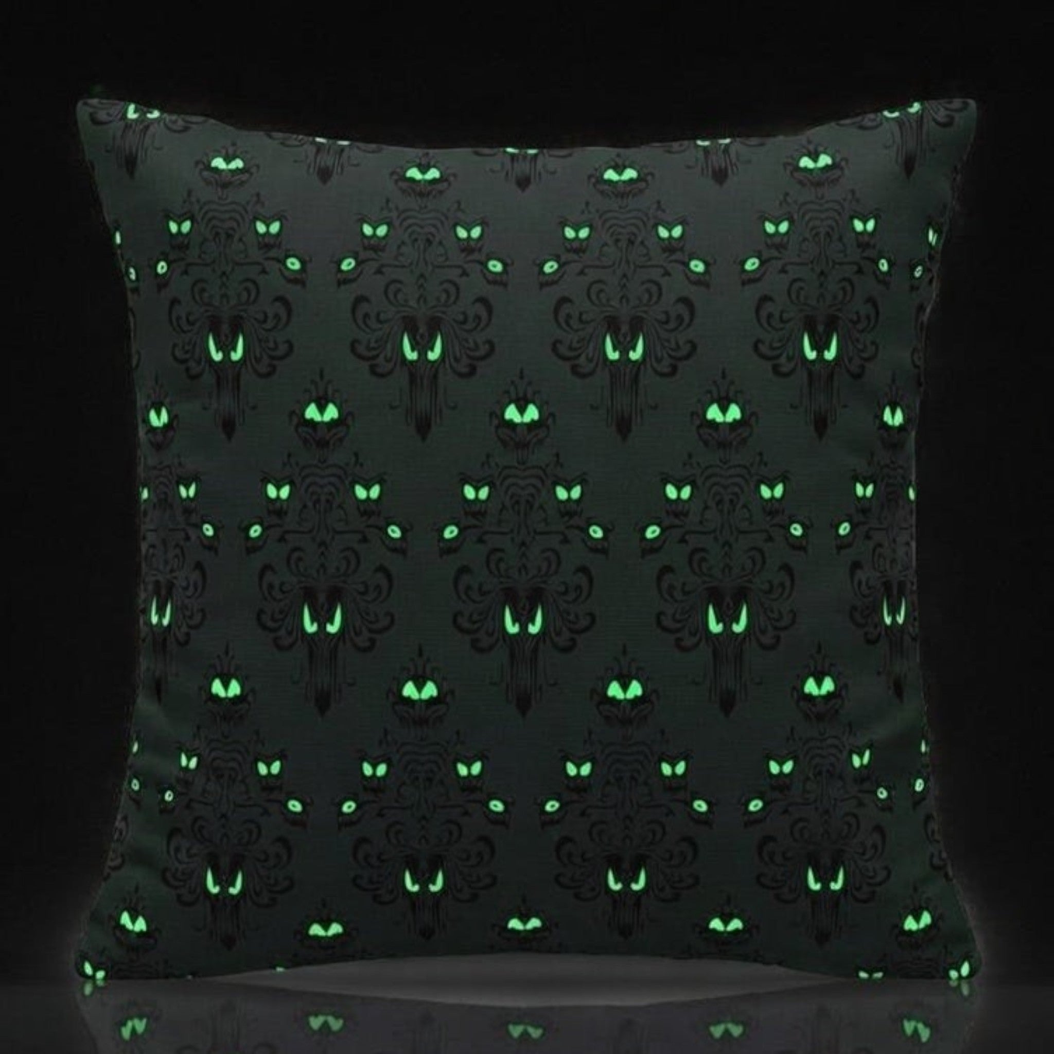 Once Upon Magic Phantom Manor glow in the dark cushion with green eyes pattern on black fabric