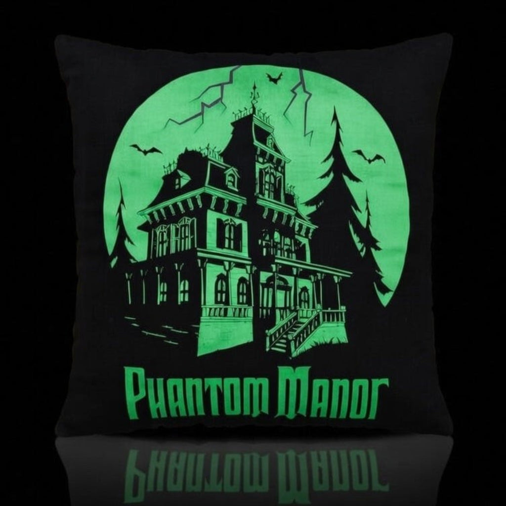 Once Upon Magic Phantom Manor glow in the dark decorative cushion featuring a haunted house design on black fabric