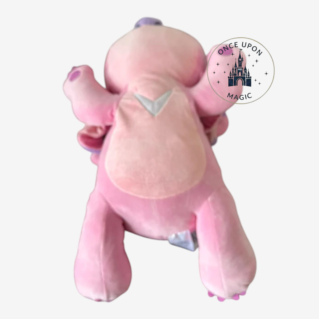 Once Upon Magic pink plush Cudleez Angel toy with purple accents and a V-shaped design on its chest.