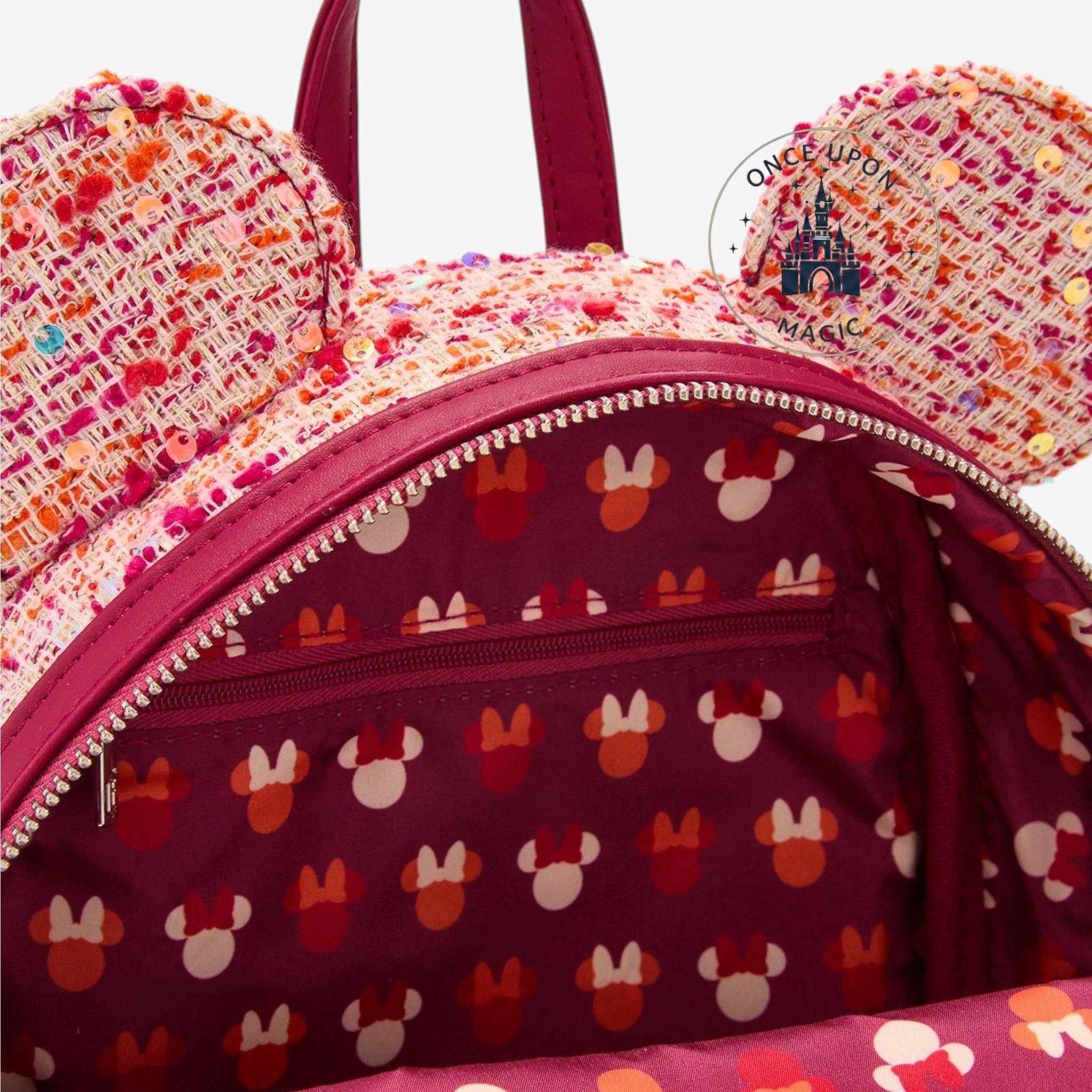 Once Upon Magic pink bouclé fabric mini backpack with Minnie Mouse ears, sequins, and a velvet bow.