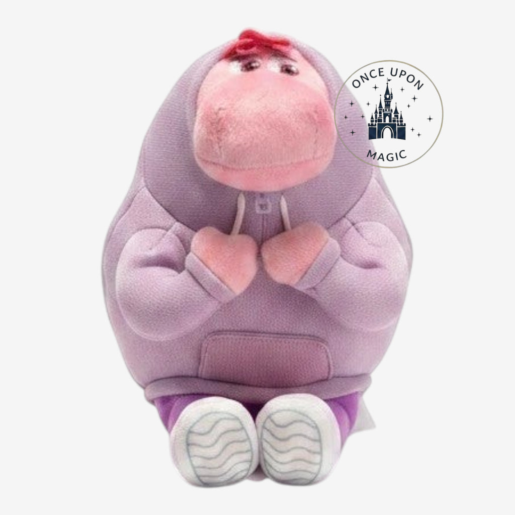 Once Upon Magic plush character wearing a lavender hoodie and white sneakers with a soft pink snout.