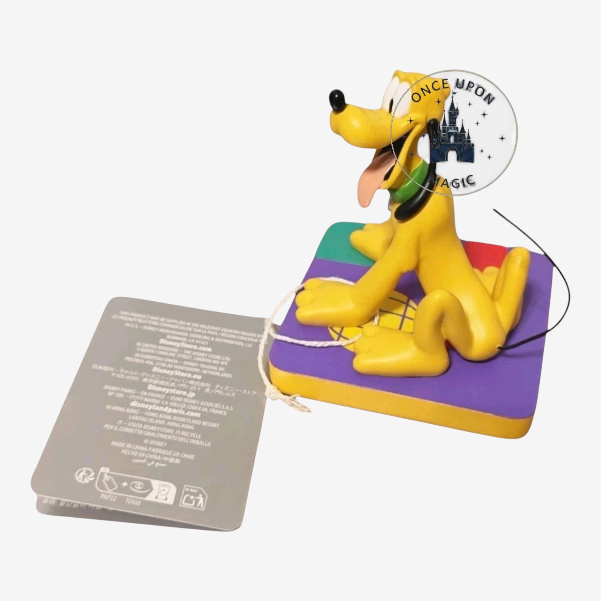Once Upon Magic Pluto figurine featuring the yellow Disney dog sitting on a colorful square base with a product tag