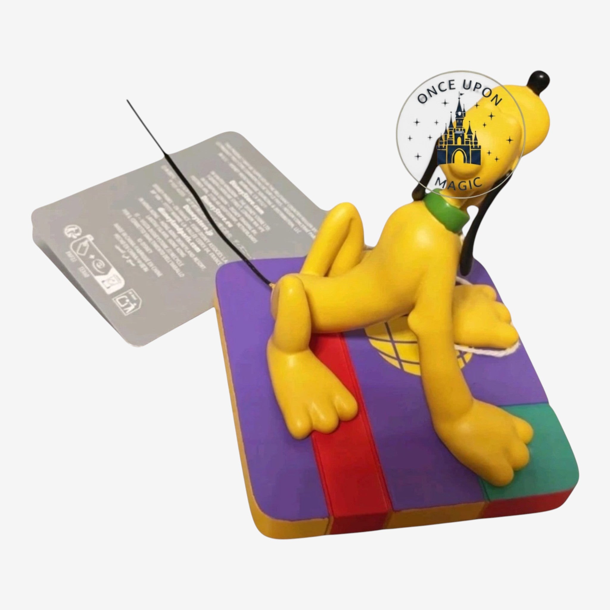 Once Upon Magic Pluto figurine featuring the yellow dog sitting on a colorful geometric base