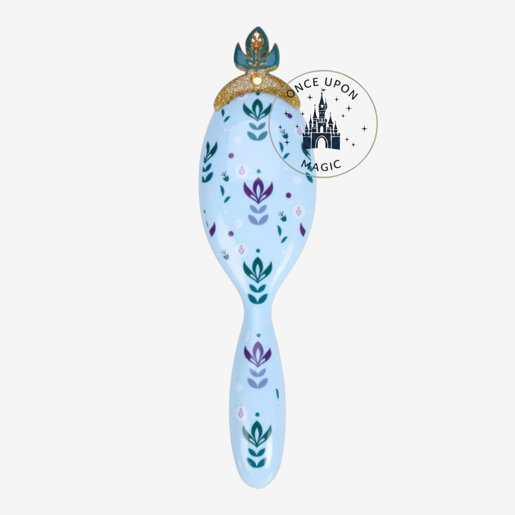 Once Upon Magic light blue hair brush with floral motifs and a crown detail, inspired by Anna from Frozen.