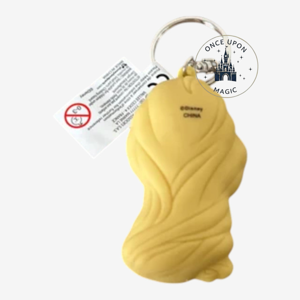 Once Upon Magic Disney Princess Rapunzel keychain accessory, yellow blonde hair, purple dress, holding frying pan.