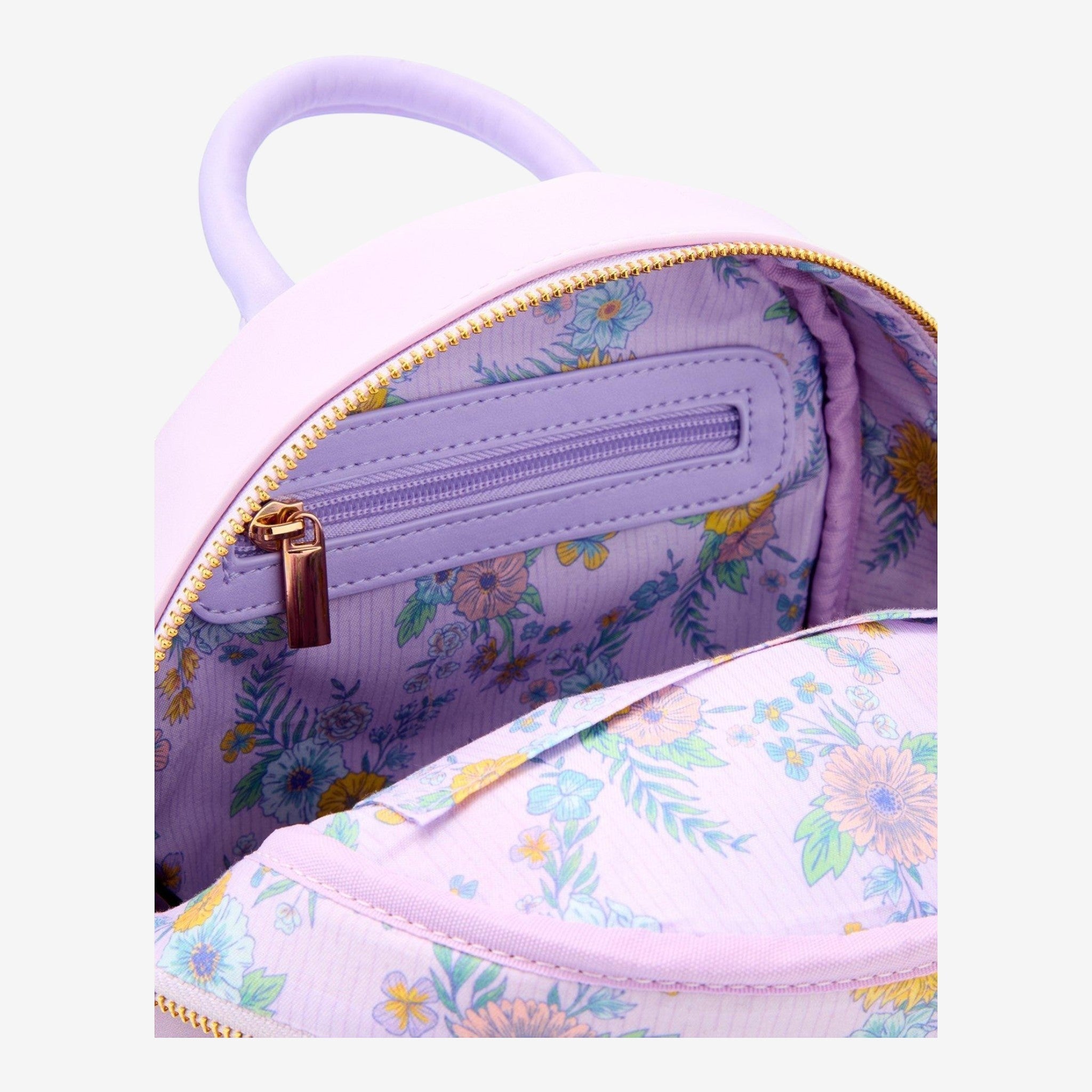 Once Upon Magic Disney Tangled Rapunzel & Maximus floral mini backpack with purple lining and gold zipper.