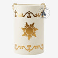 Once Upon Magic cream glass lantern with gold sun and scroll details, inspired by Rapunzel. Features a gold chain handle.
