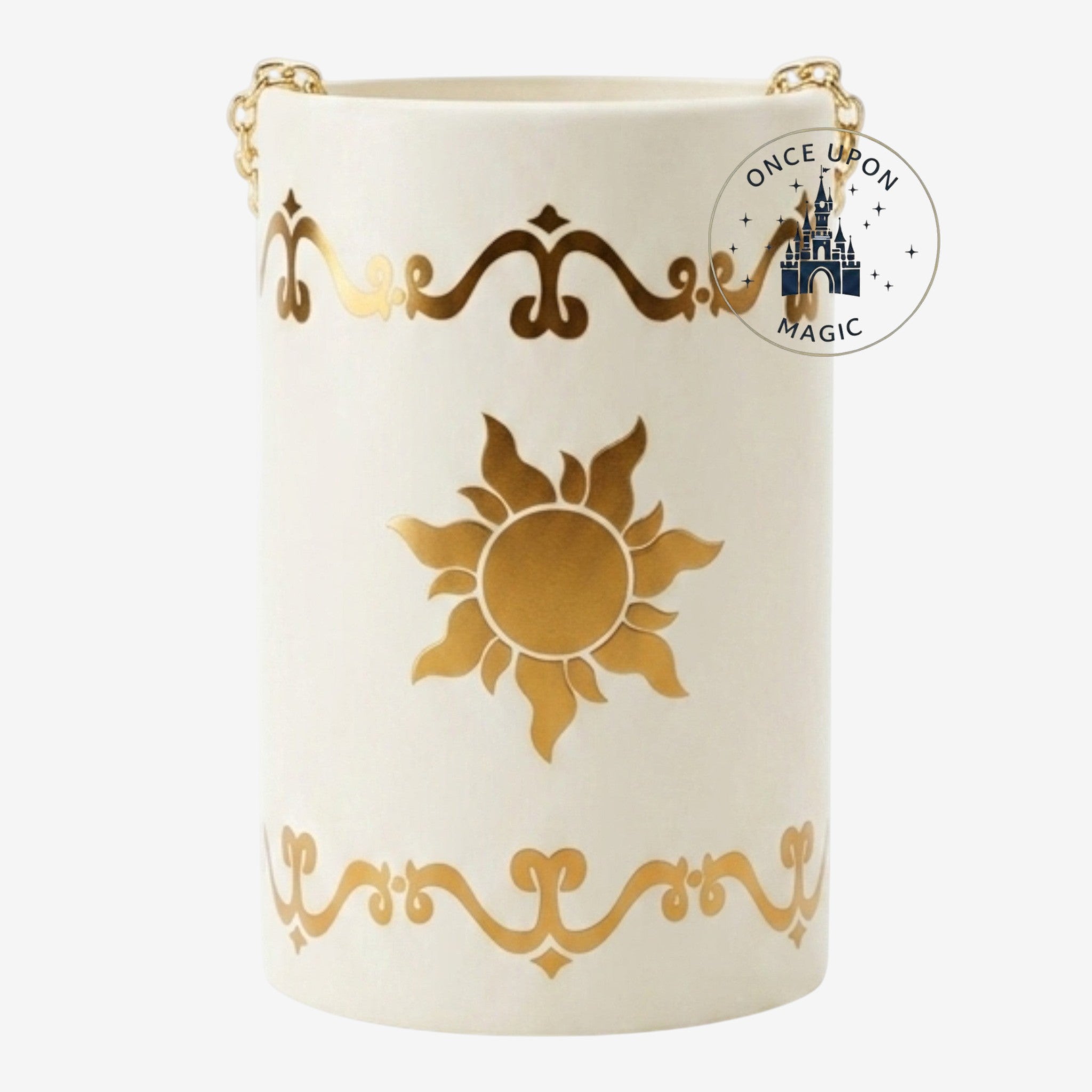 Once Upon Magic cream glass lantern with gold sun and scroll details, inspired by Rapunzel. Features a gold chain handle.