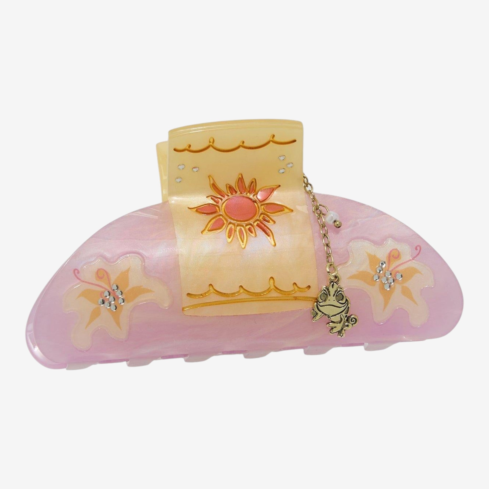 Once Upon Magic Rapunzel lantern claw hair clip with sun and flower details and Pascal charm.