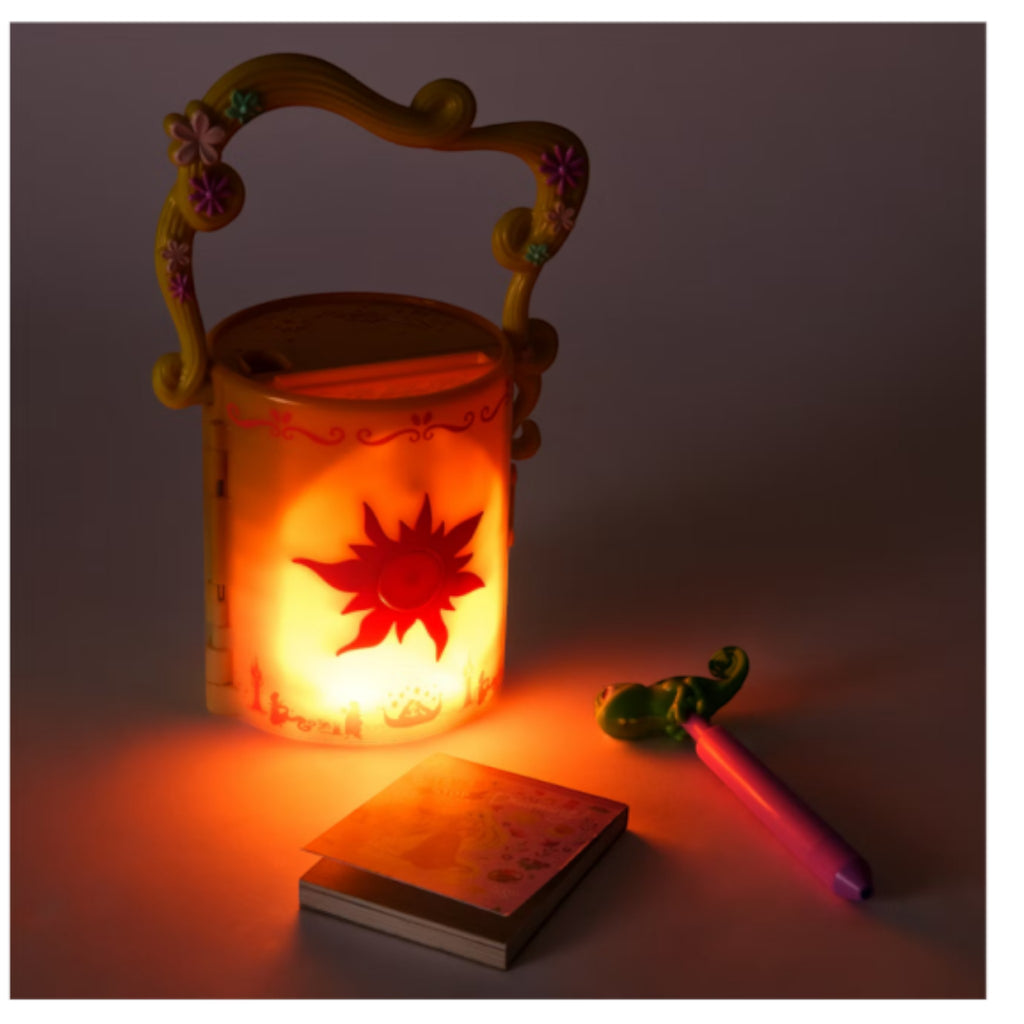 Once Upon Magic Rapunzel lantern diary playset with glowing sun emblem, flower handle, notebook, and Pascal pen.