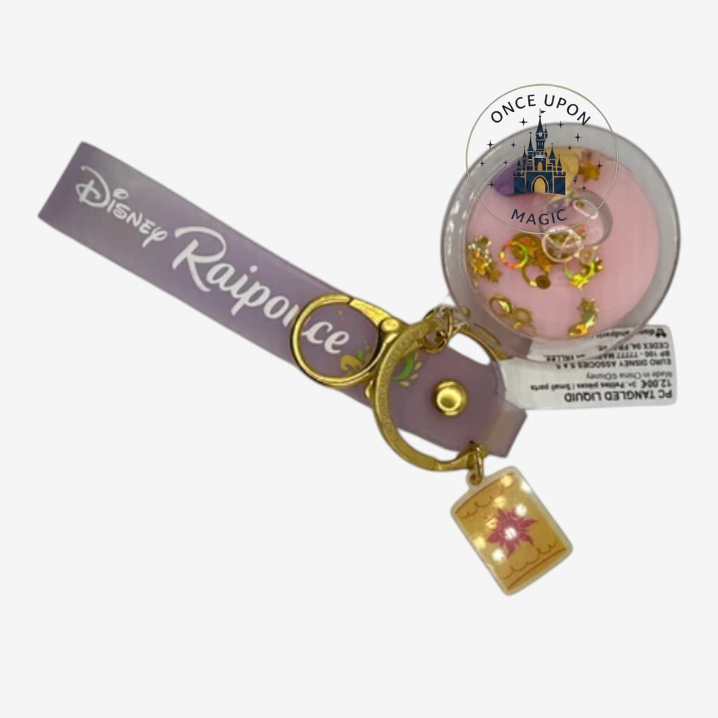 Once Upon Magic purple Rapunzel keychain with a clear liquid-filled charm featuring glitter and a small Rapunzel figure.