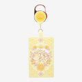Once Upon Magic yellow retractable lanyard with Rapunzel and Maximus floral design, featuring a crown and sunflowers.