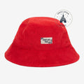 Once Upon Magic red terry cloth bucket hat with subtle Stitch pattern and Disneyland Paris label. Summer accessory.