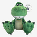 Once Upon Magic Rex Big Feet plush toy from Toy Story with soft green fabric and large padded feet in sitting pose.