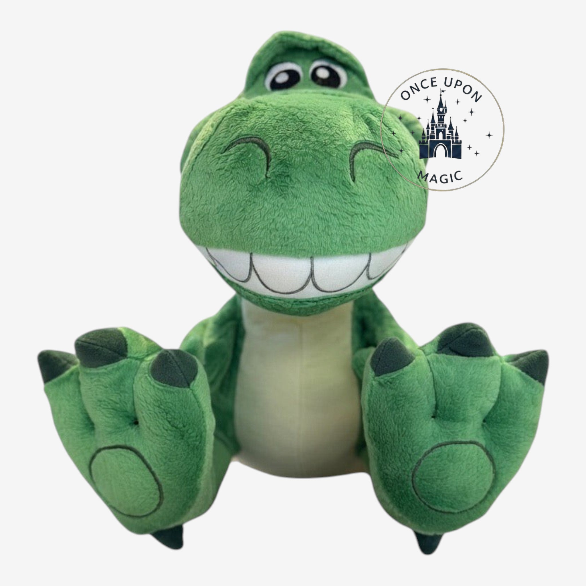 Once Upon Magic Rex Big Feet plush toy from Toy Story with soft green fabric and large padded feet in sitting pose.
