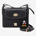 Sac bandoulière noir en cuir Once Upon Magic avec figurine Mickey Mouse, surpiqûres contrastées et quincaillerie dorée.