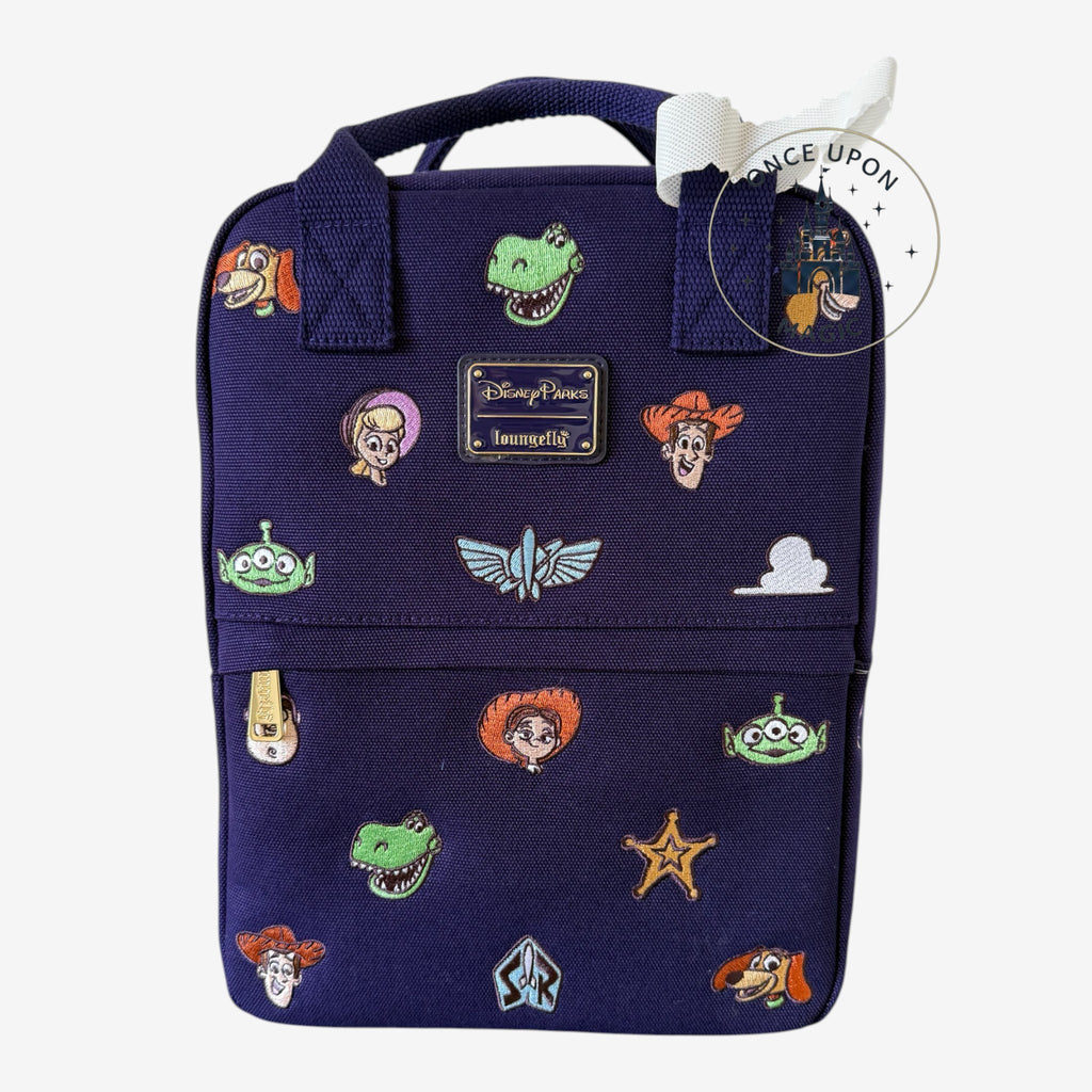 Mini sac à dos Loungefly Disney Toy Story bleu nuit en toile avec broderies de personnages et fermeture éclair dorée.