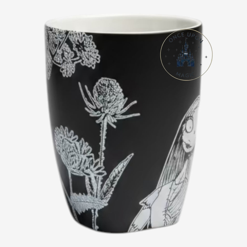 Once Upon Magic black ceramic mug featuring white line art of Sally from The Nightmare Before Christmas and flowers.