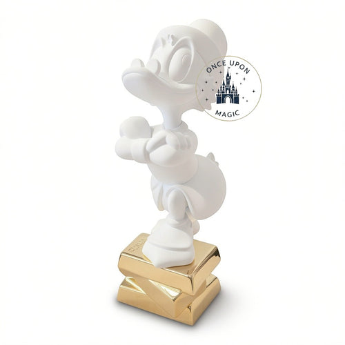 Once Upon Magic collectible white Scrooge McDuck figurine by Leblon Delienne standing on a gold base