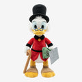 Once Upon Magic Scrooge McDuck plush toy with red coat, top hat, cane, and money bag.