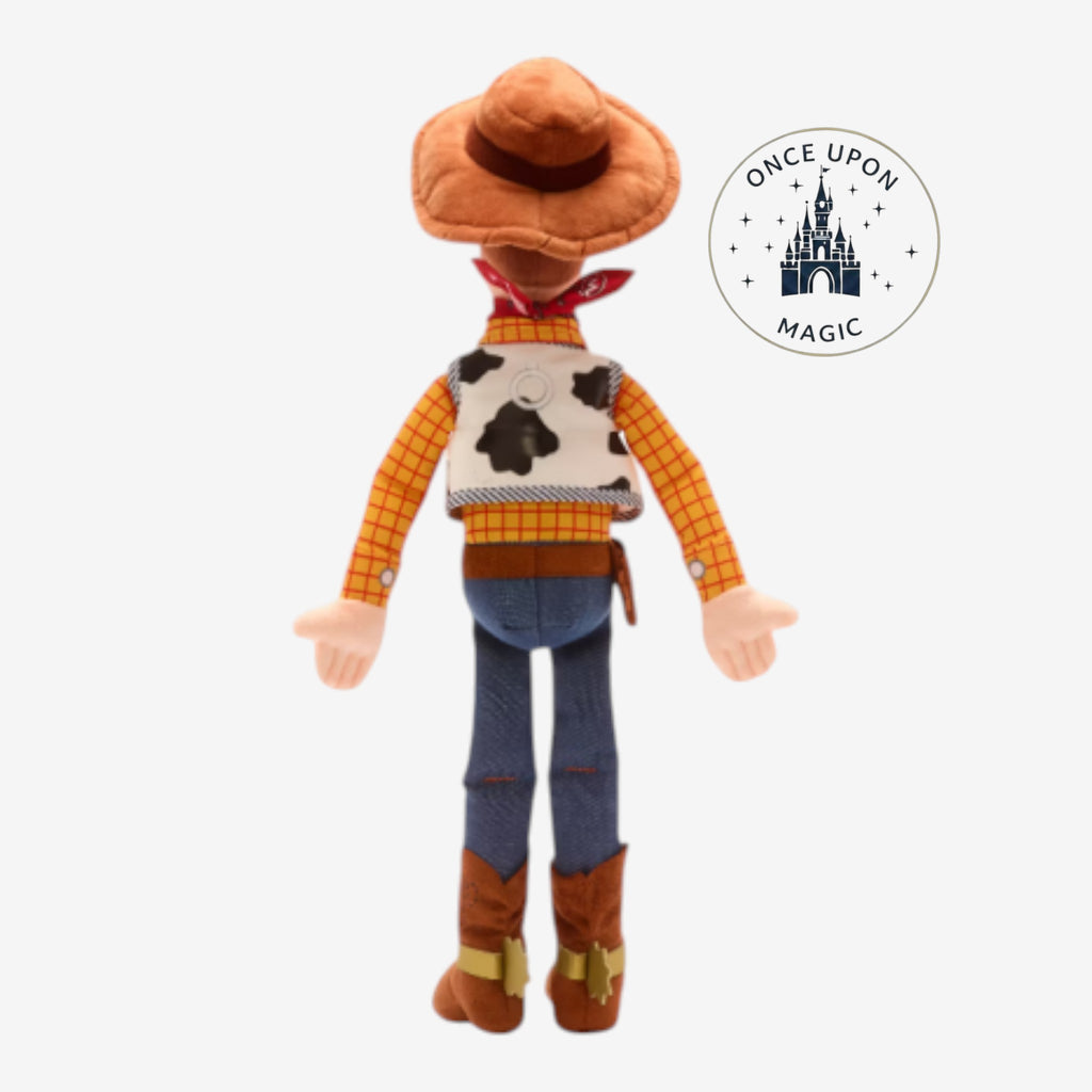 Once Upon Magic Sheriff Woody plush doll from Toy Story, shown from the back wearing a cow-print vest and cowboy hat.