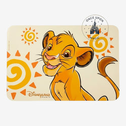 Once Upon Magic Simba placemat featuring young Simba, stylized suns, and Disneyland Paris logo on a warm sand background