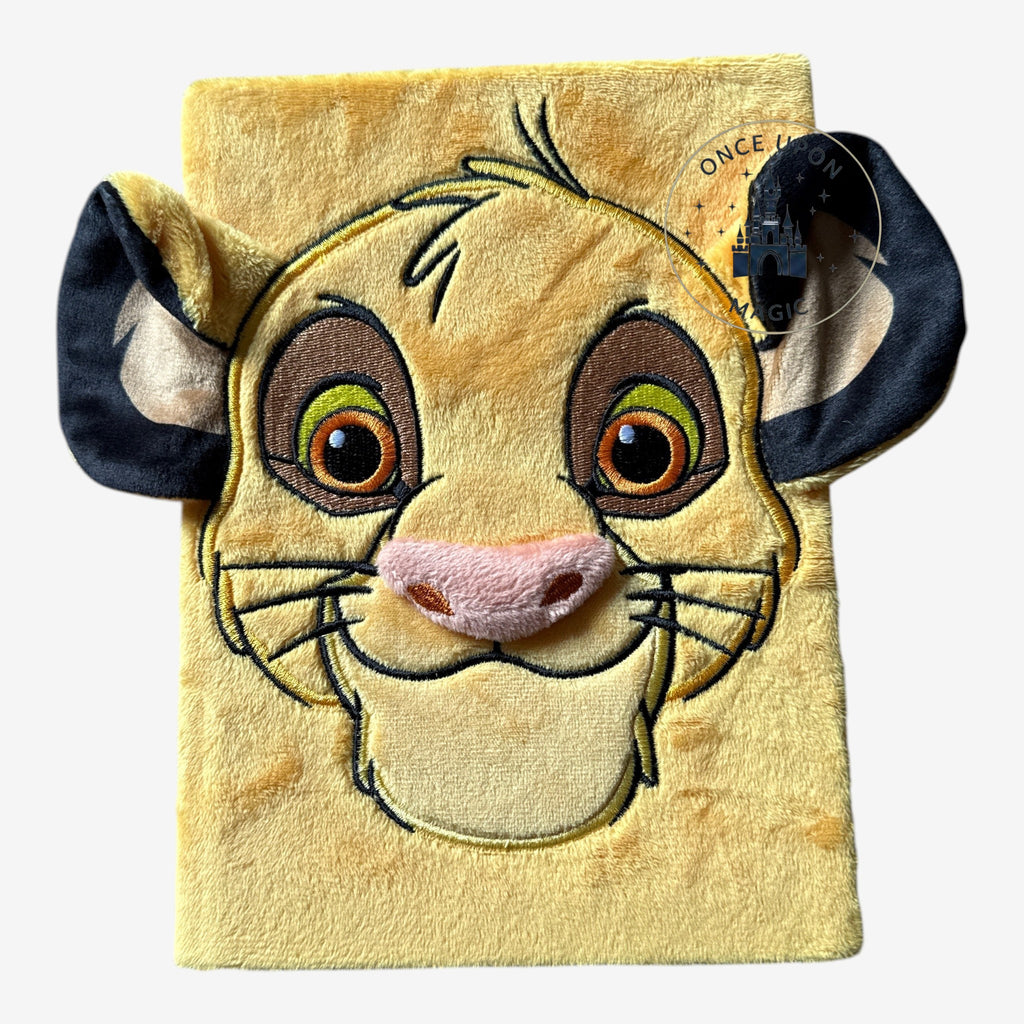Once Upon Magic yellow plush Simba notebook with 3D ears and embroidered face details.