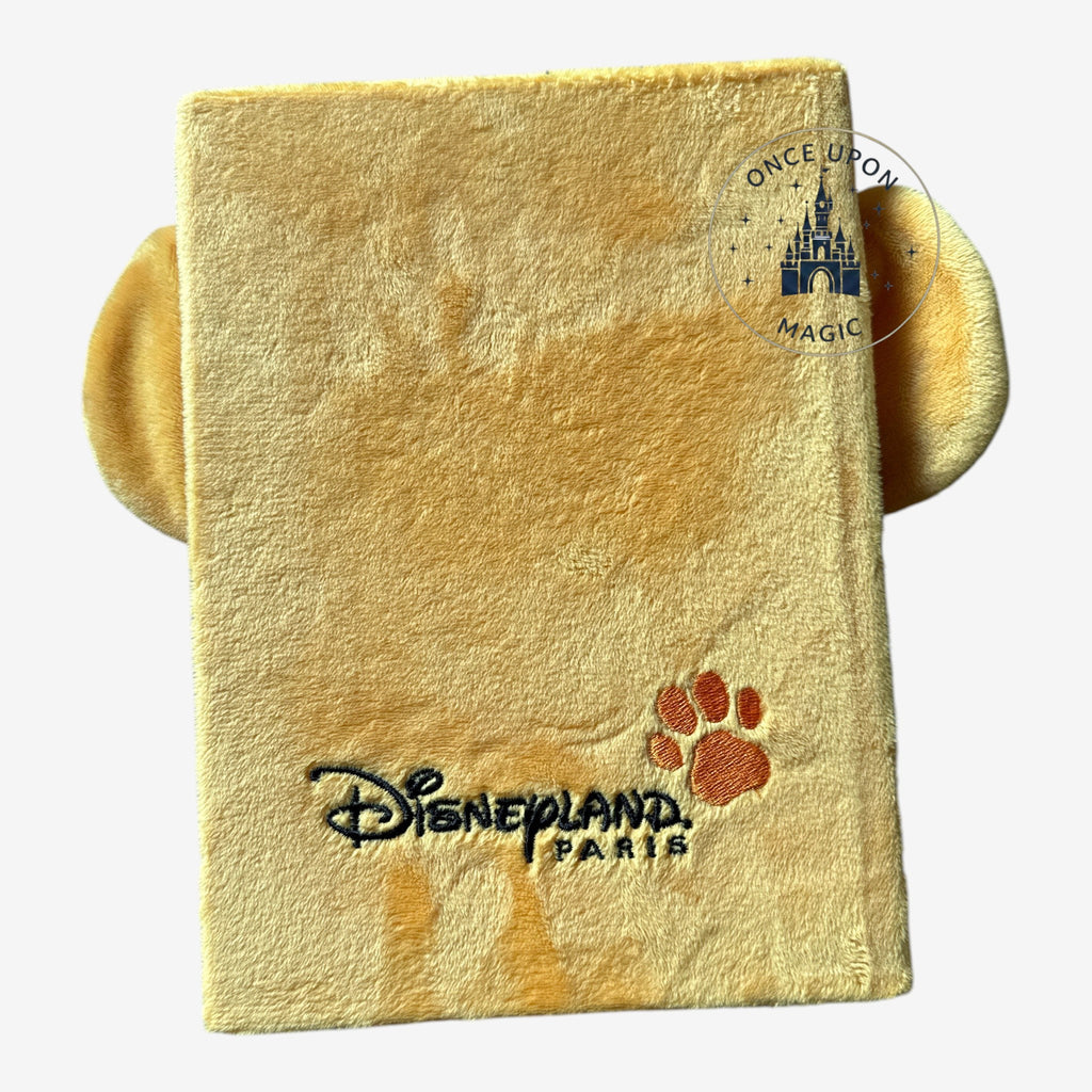 Once Upon Magic yellow plush Simba notebook with Disneyland Paris logo and paw print.