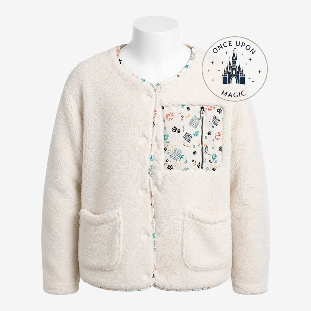 Once Upon Magic cream sherpa jacket featuring Simba jungle print pocket and trim, official Disney Lion King design.