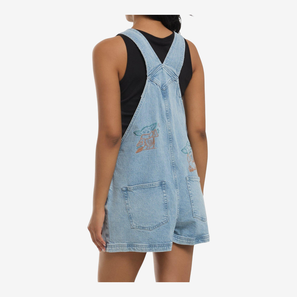 Once Upon Magic light wash denim Star Wars The Mandalorian & Grogu line art embroidered short overalls. Features adjustable straps and pockets.