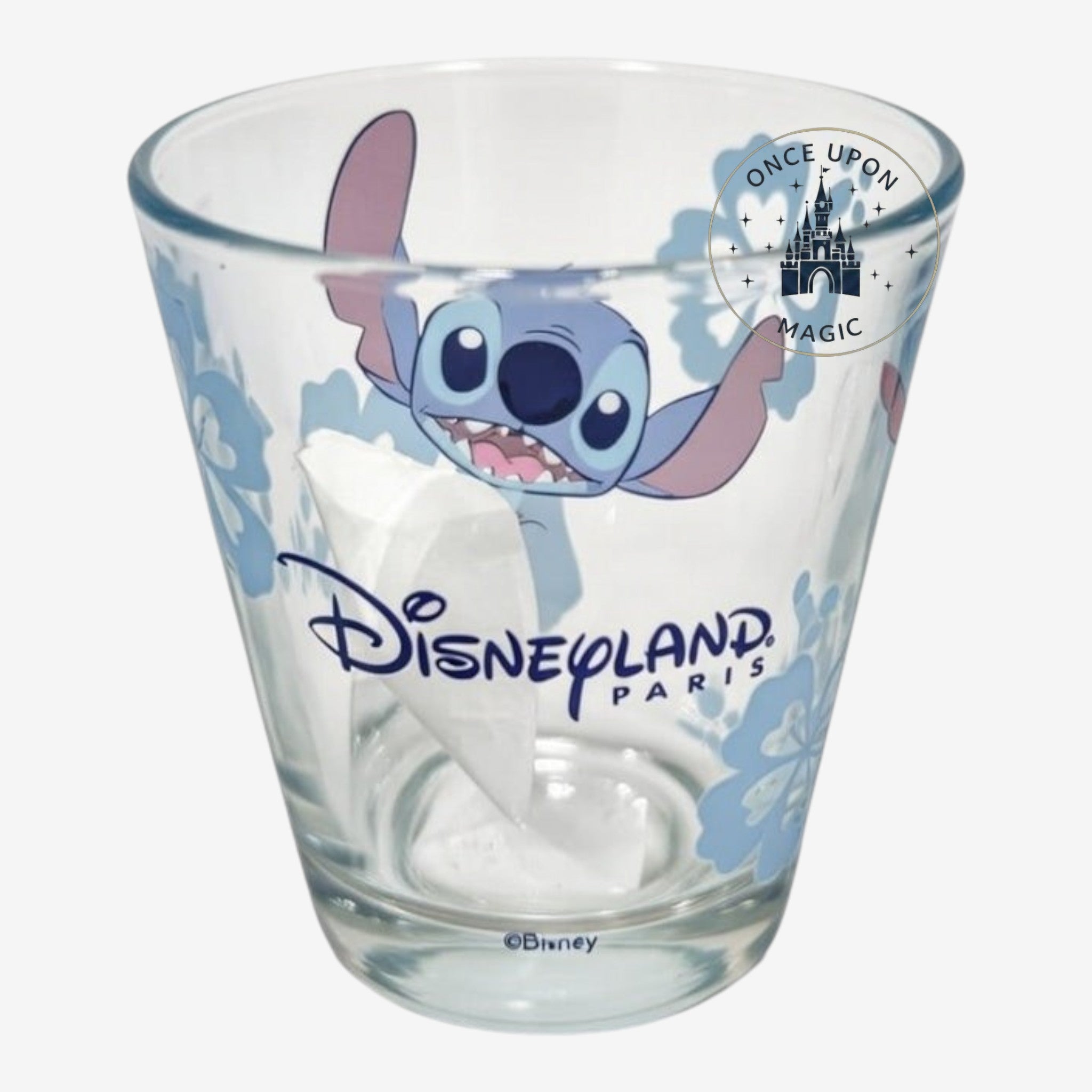 Once Upon Magic Stitch floral glass with Disneyland Paris logo and pastel blue tropical flowers.