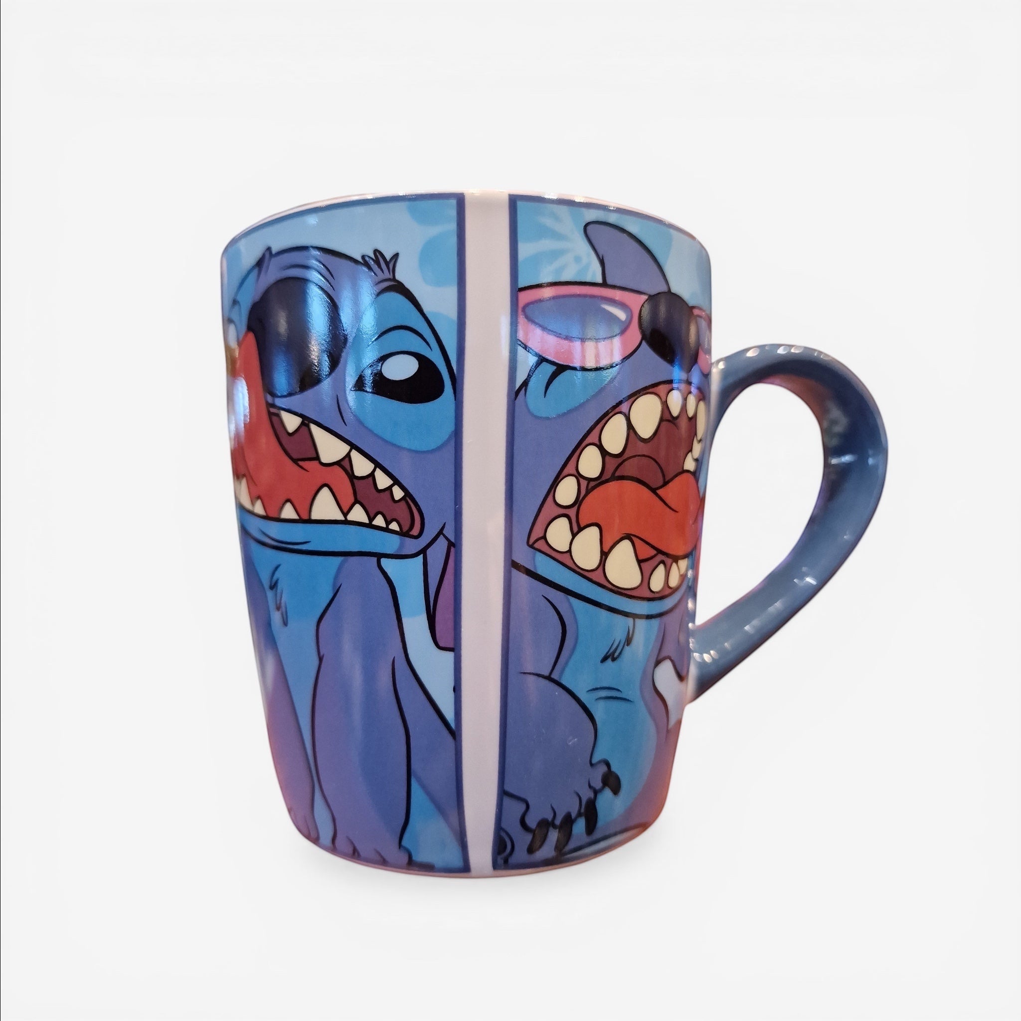 Once Upon Magic blue ceramic mug featuring Stitch with two different funny grimaces, one with sunglasses.