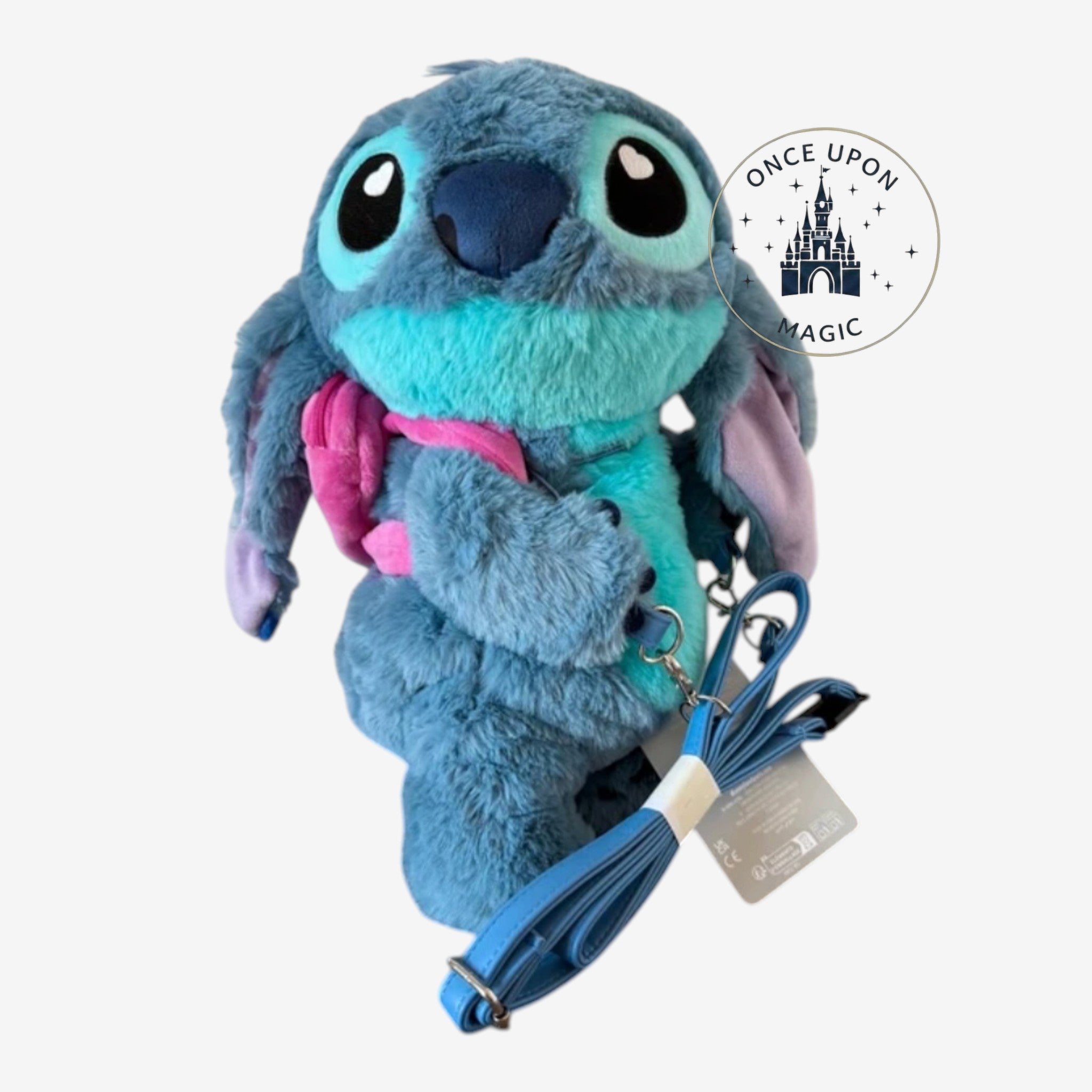 Once Upon Magic Stitch plush crossbody bag in blue with large ears and a detachable pink mini-backpack accessory.