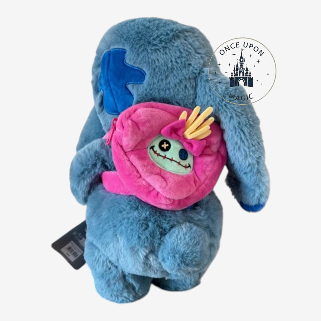 Once Upon Magic Stitch plush crossbody bag in blue with a detachable pink mini-backpack accessory on the back.