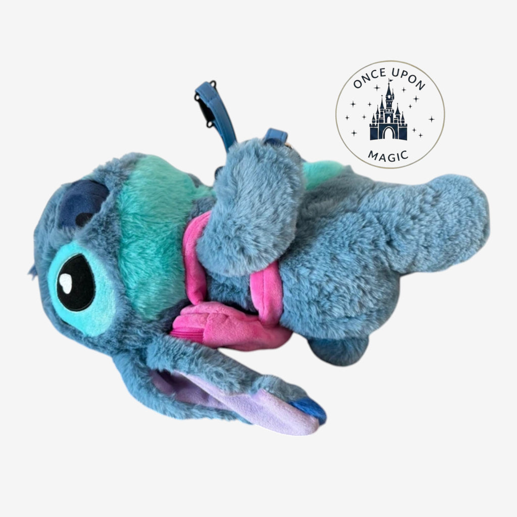 Once Upon Magic Stitch plush crossbody bag in blue with a detachable pink mini-backpack accessory.