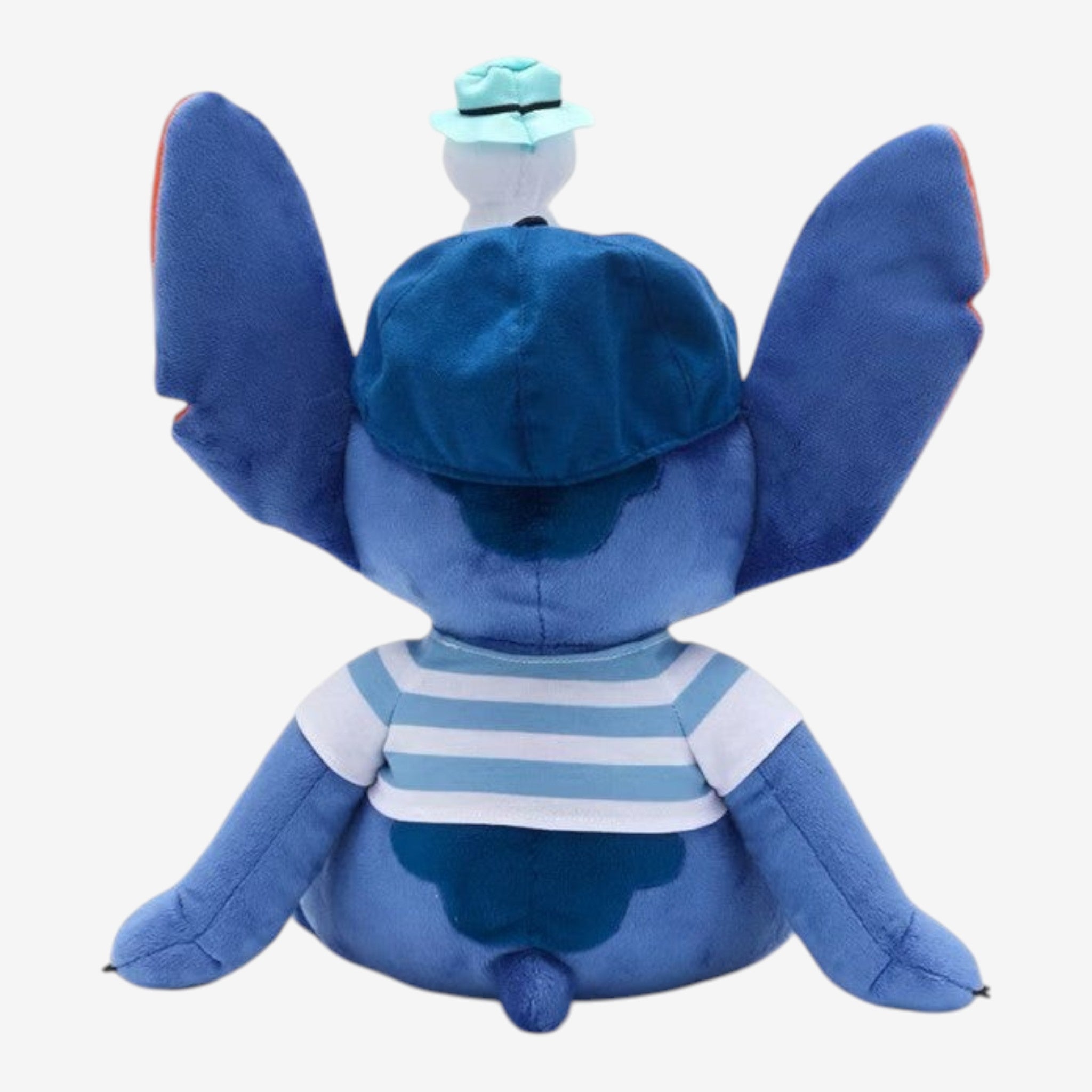 Once Upon Magic Stitch plush toy wearing a blue baseball cap with a duck accessory and a blue & white striped shirt.
