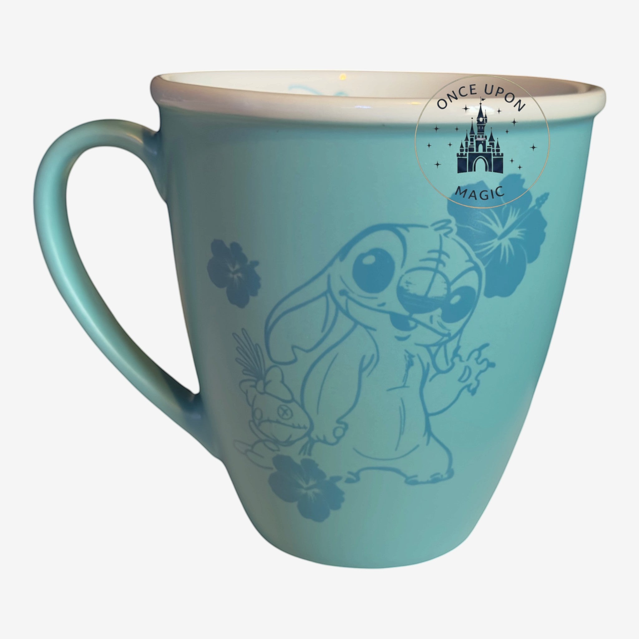 Once Upon Magic teal ceramic coffee mug featuring a Stitch illustration and hibiscus flower accents.