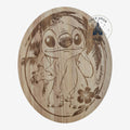 Once Upon Magic round wooden cutting board with engraved Stitch and tropical leaves. Perfect for food prep or serving.