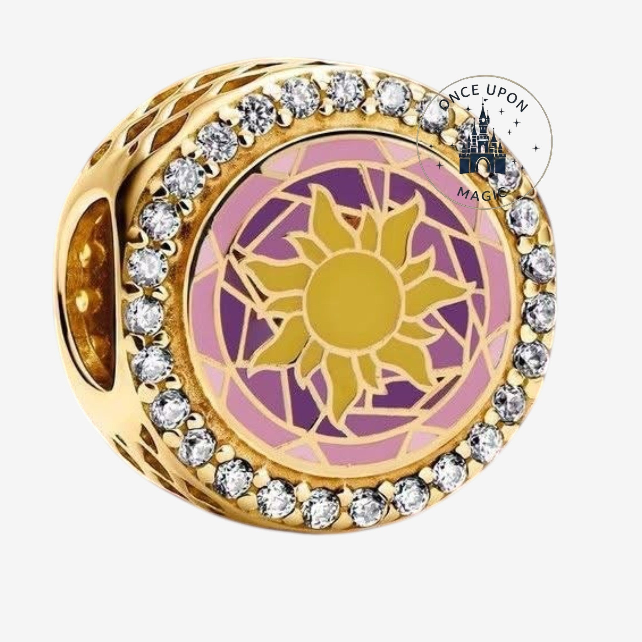Once Upon Magic gold charm with sun design, purple and pink enamel, and clear crystals